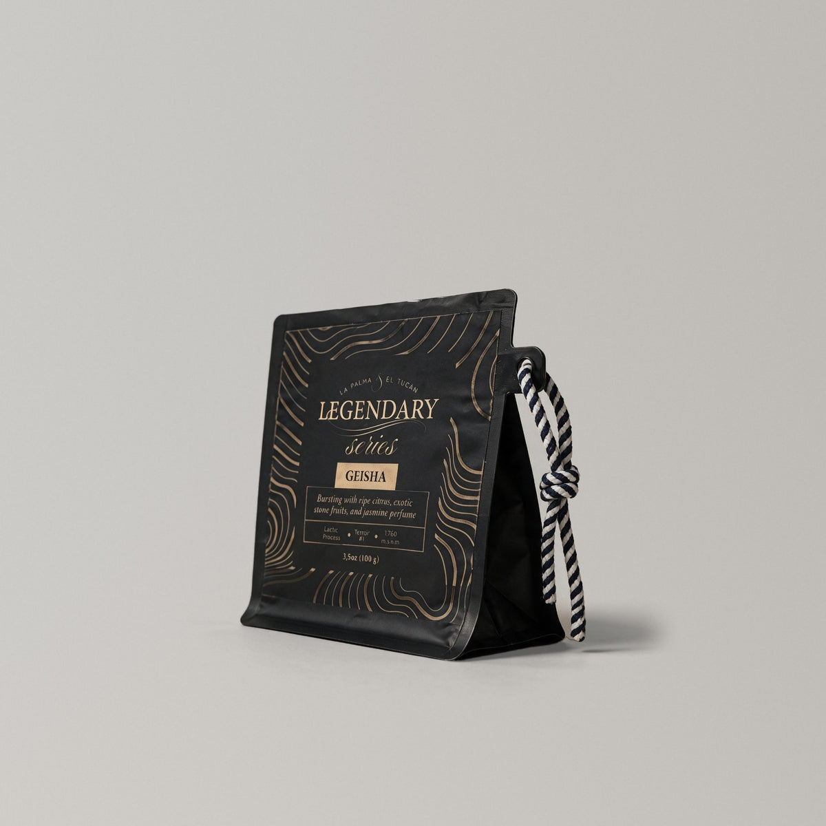 Legendary Geisha 90+ 3.5 oz (100 g) black coffee bag, side view with the striped rope