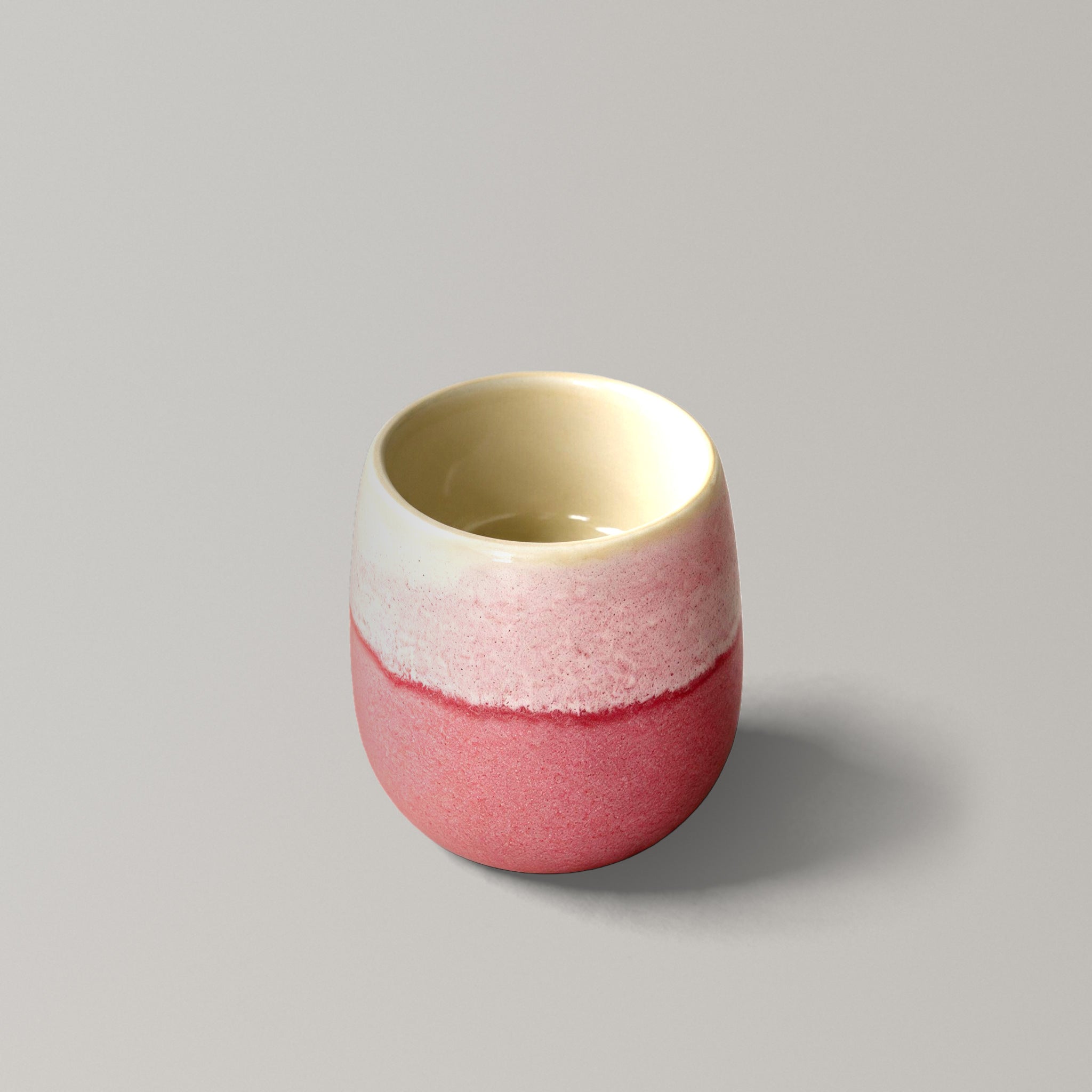 The Daily Cup, handmade stoneware cup with coral and speckled pink glaze