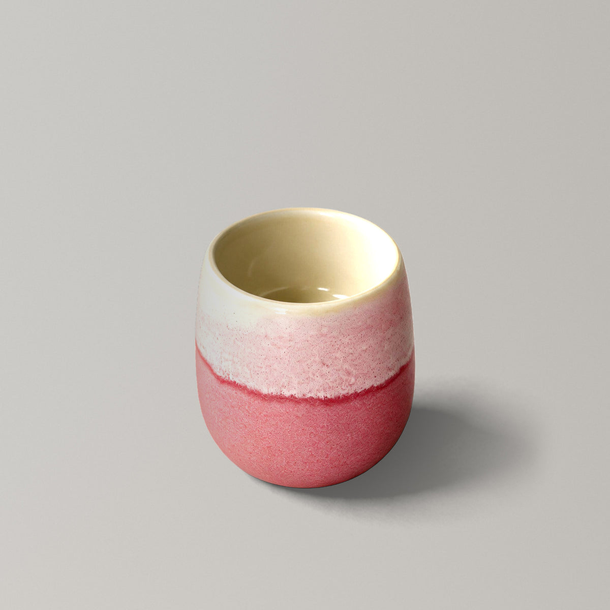 The Daily Cup, handmade stoneware cup with coral and speckled pink glaze