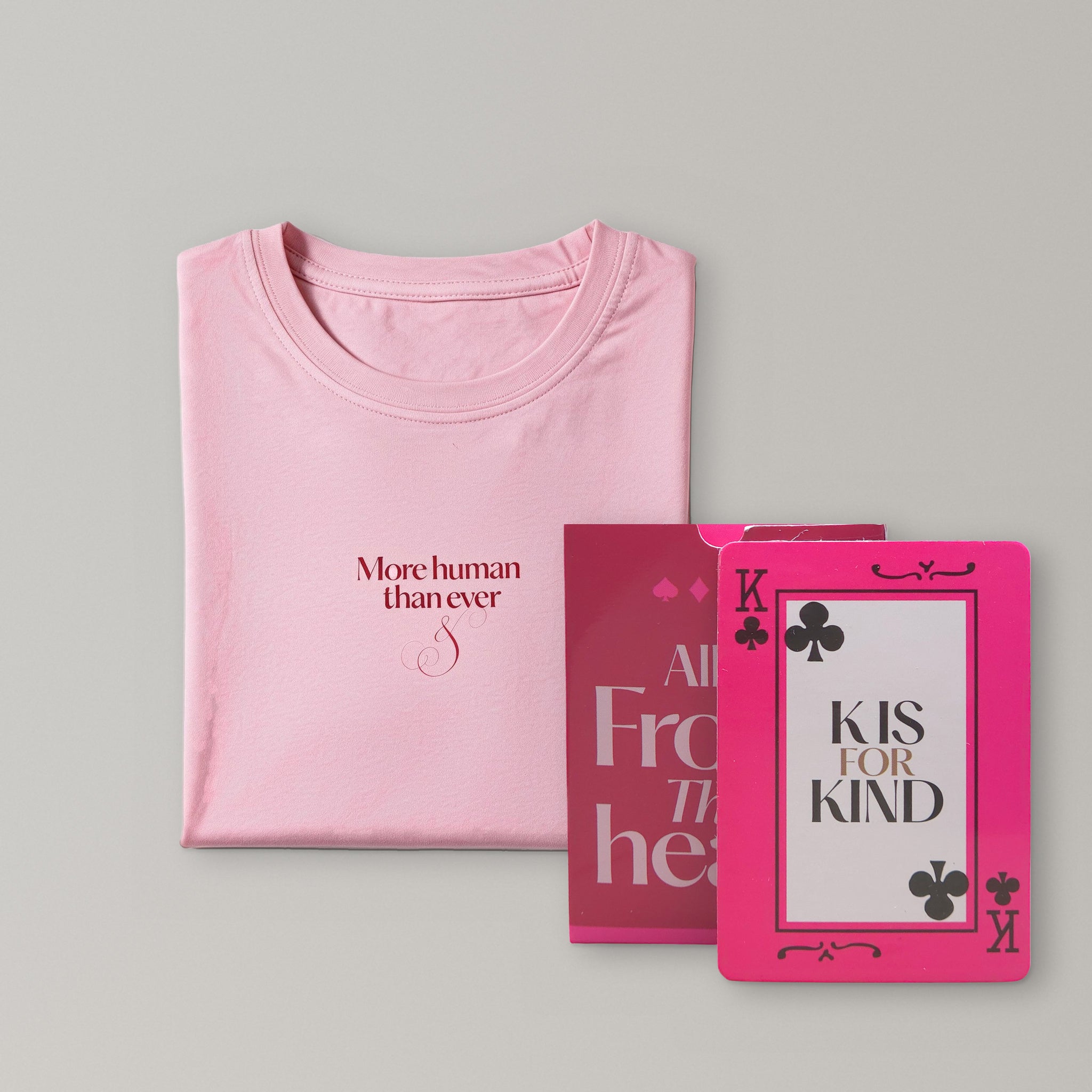 The Bundle: pink La Palma & El Tucán T-shirt folded with the playing cards box and the King card
